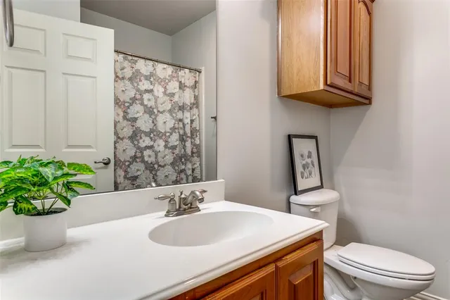 a bathroom with a sink a toilet and tub