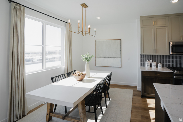 2012 West 1150 South, Unit 1018 Payson, UT 84651 - Photo 7 of 25 Dining room with dark wood finished floors and a chandelier