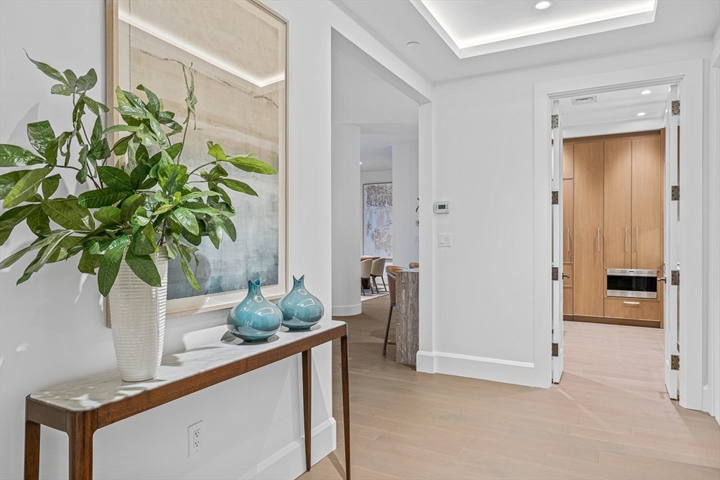 40 Trinity Place, Unit PH34D Boston, MA 02116 - Photo 31 of 37 a room with view of potted plants and kitchen view