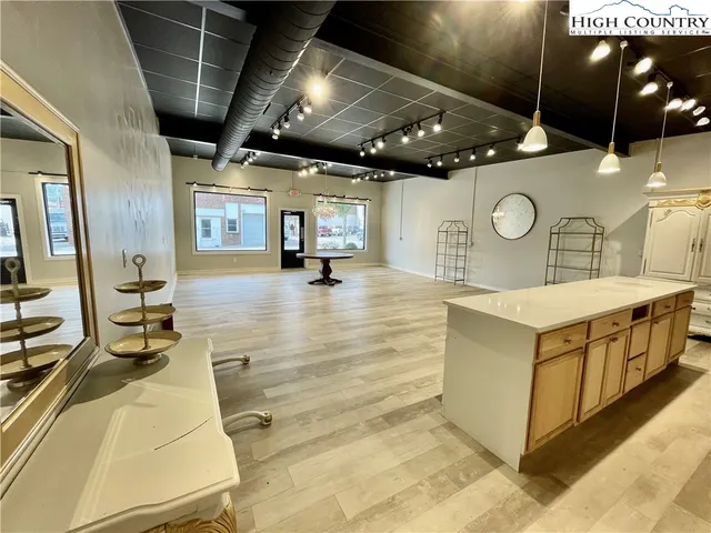 a large white kitchen with lots of counter space
