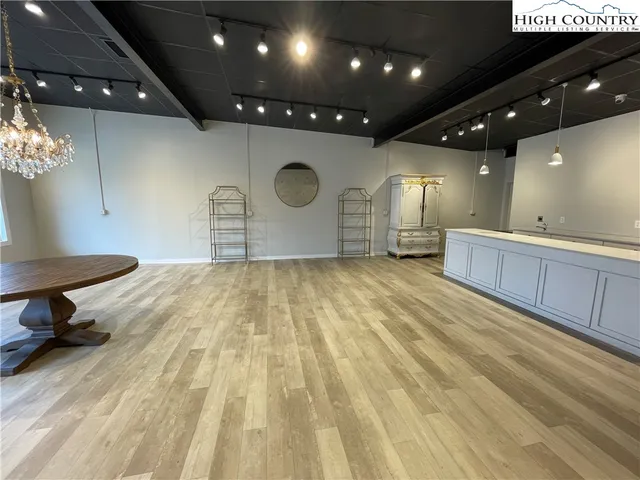 a bathroom with a sink a mirror and a shower