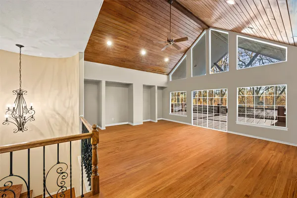 a view of an entryway with wooden floor and door