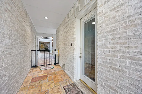a living room with furniture a flat screen tv and a window