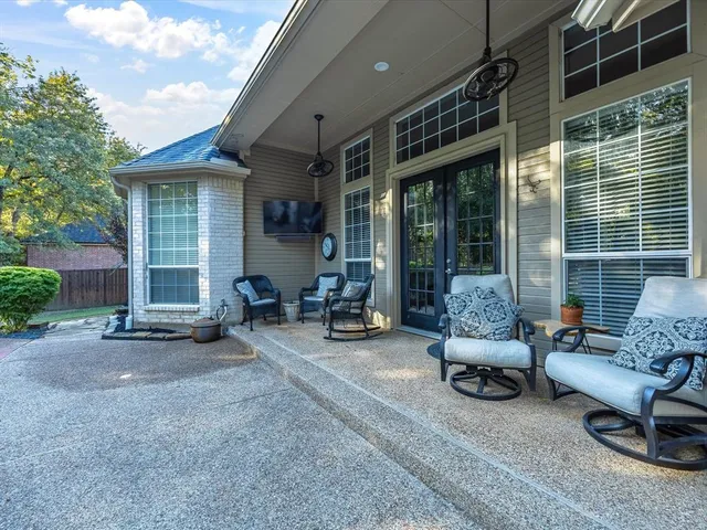 a view of a backyard with swimming pool