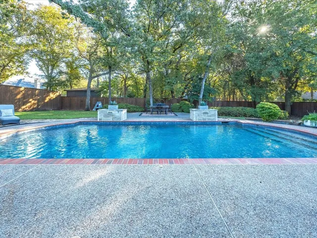 a view of a patio with couple of chairs and a couch