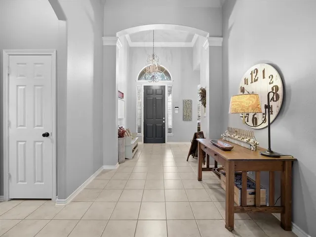 a kitchen with stainless steel appliances a refrigerator and a stove top oven