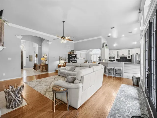 a living room with furniture fireplace and flat screen tv