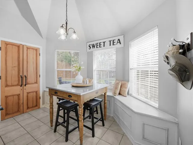 a kitchen with stainless steel appliances granite countertop a sink and a refrigerator