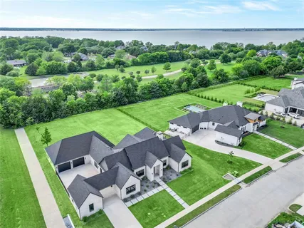 an aerial view of a house with garden space and street view
