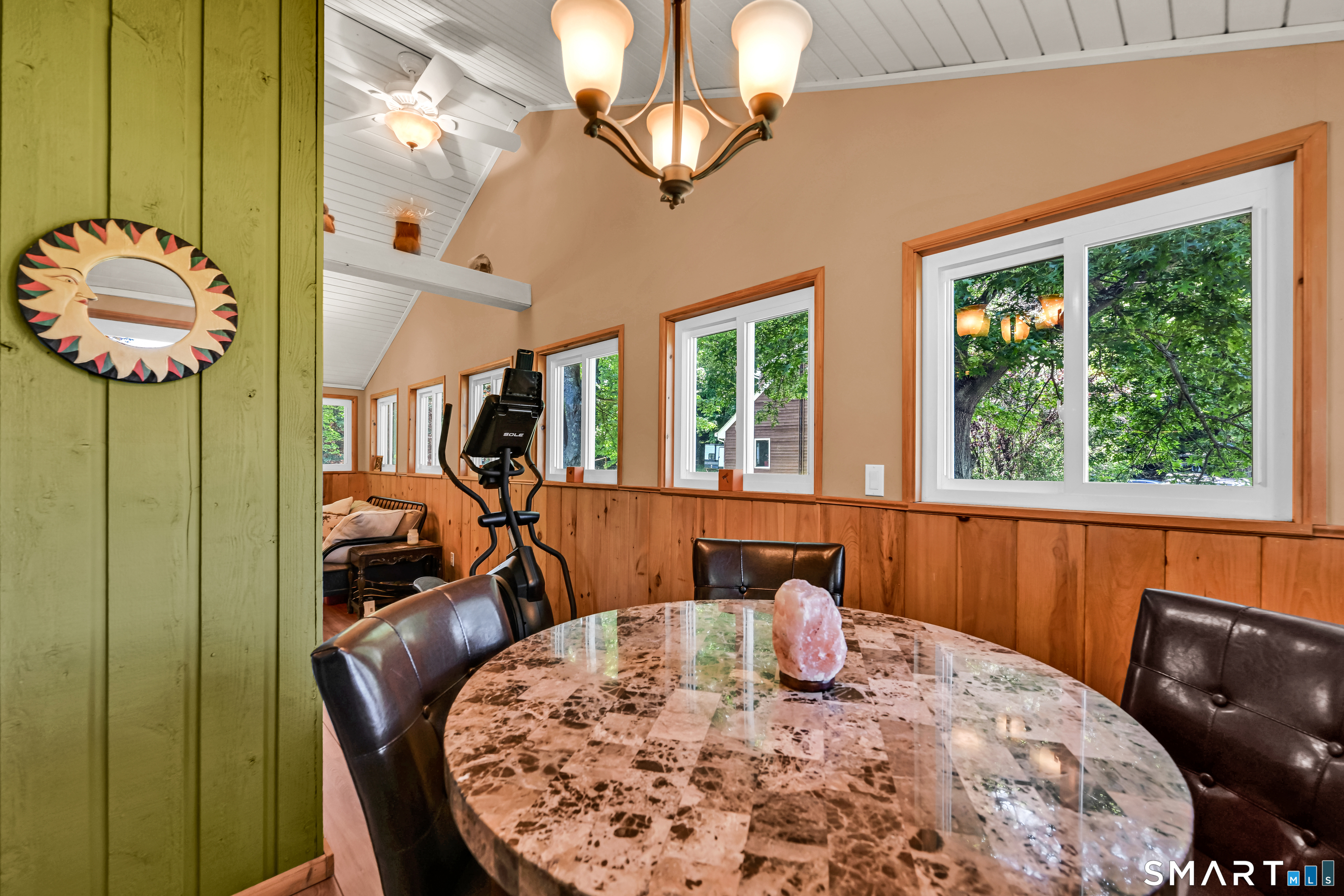 93 Court Street Cromwell, CT 06416 - Photo 9 of 38 seating area in enclosed porch.