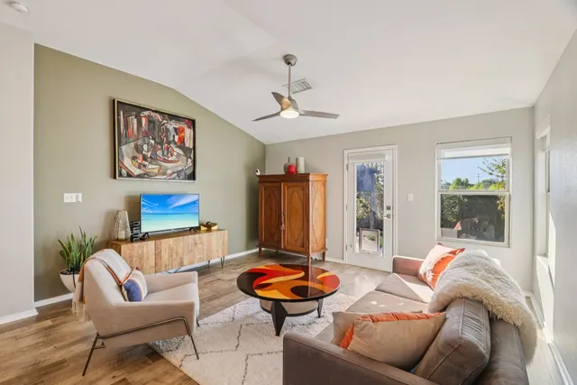 a living room with furniture and a window