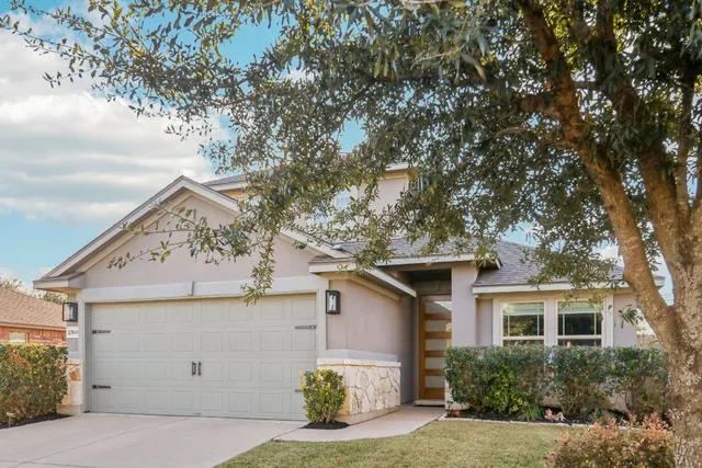 a front view of a house with a garage
