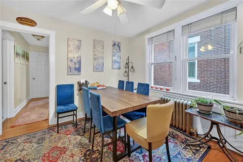 a view of a dining room with furniture window and wooden floor