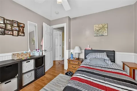 a bedroom with furniture and a window