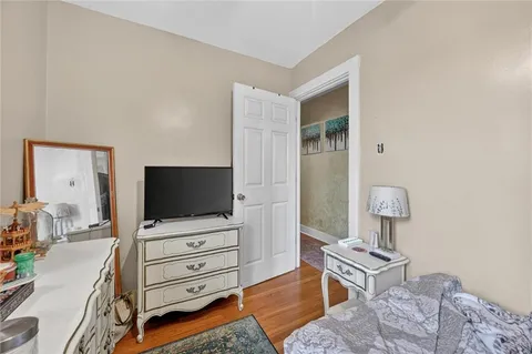a room with furniture and flat screen tv