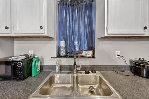 a kitchen with a sink and cabinets