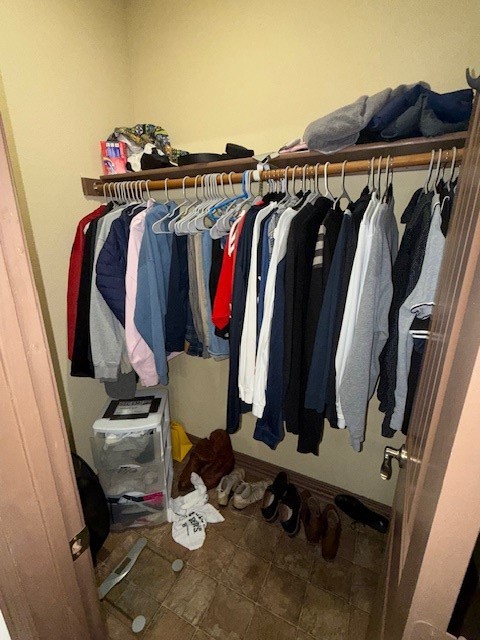 2410 2nd Street South, Unit 416 Waco, TX 76706 - Photo 22 of 40 a view of walk in closet with clothes and shoes