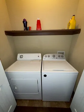 a bedroom with a bed dresser and a flat screen tv