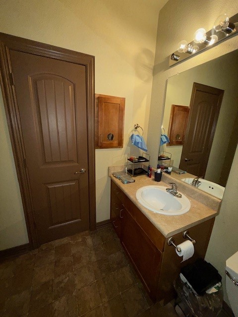 2410 2nd Street South, Unit 416 Waco, TX 76706 - Photo 35 of 40 a bathroom with a sink vanity granite and a mirror