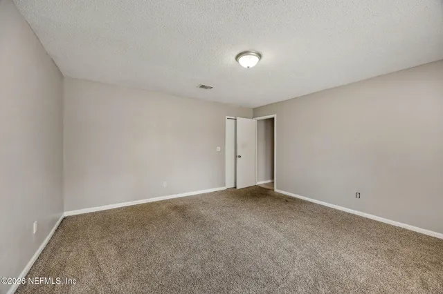 a view of a room with an empty space