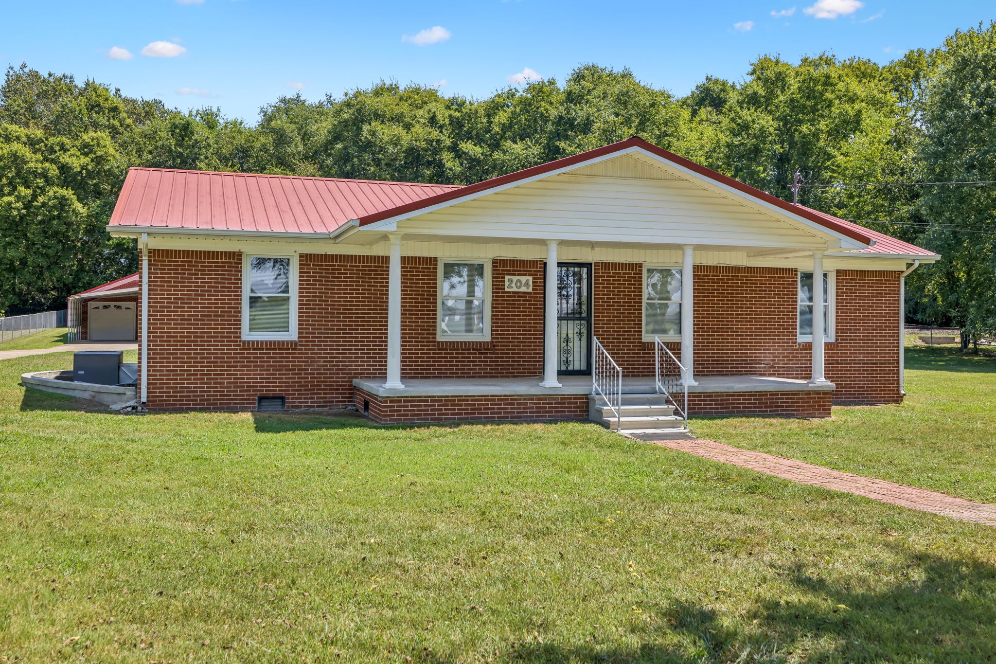 204 Canaan Road Mount Pleasant, TN 38474 - Photo 11 of 49 a view of a house with a yard
