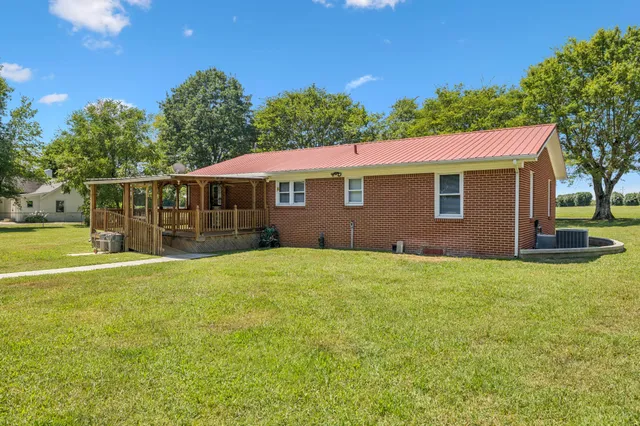 a view of a house with a big yard
