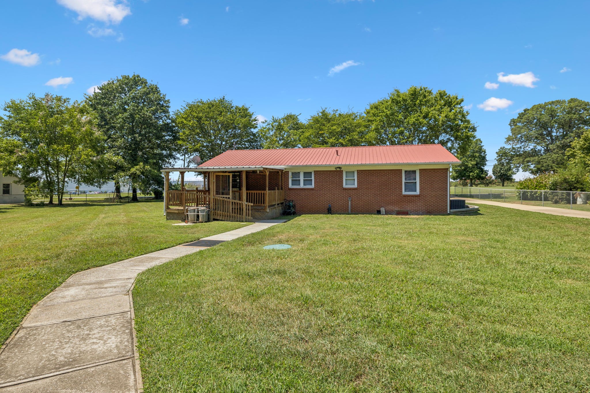 204 Canaan Road Mount Pleasant, TN 38474 - Photo 40 of 49 a view of a house with a big yard