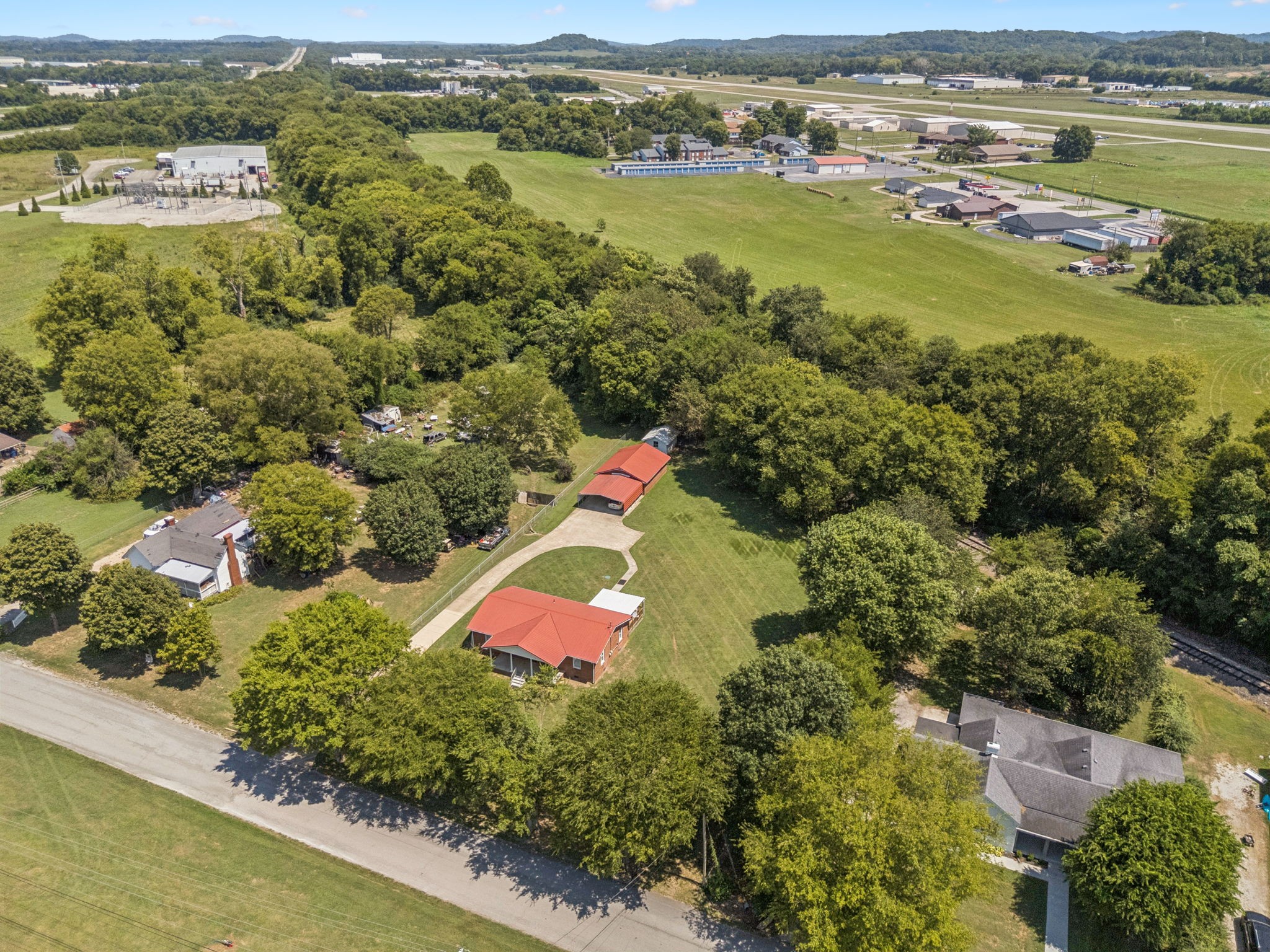 204 Canaan Road Mount Pleasant, TN 38474 - Photo 43 of 49 an aerial view of residential houses with outdoor space and mountain view