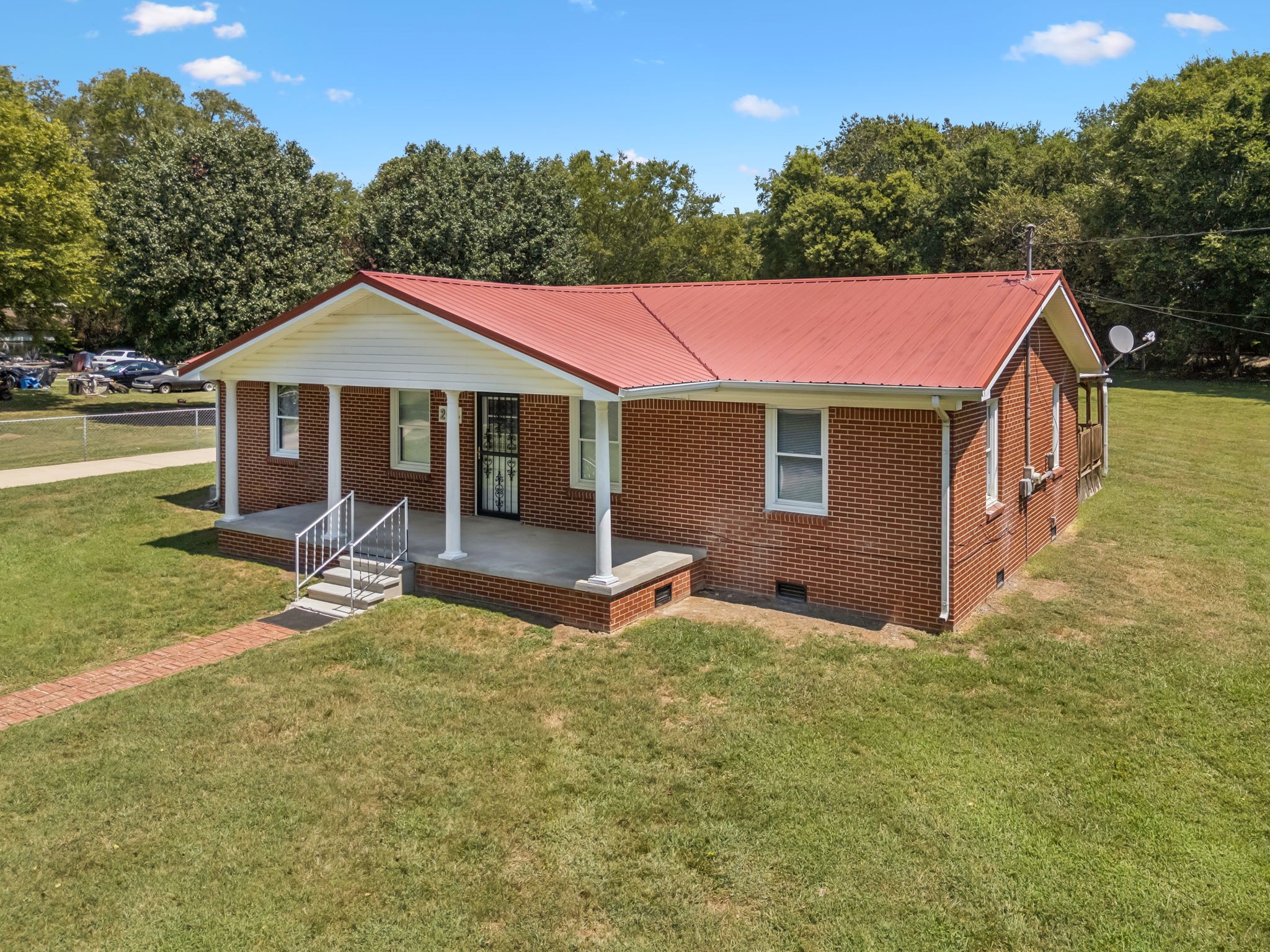 204 Canaan Road Mount Pleasant, TN 38474 - Photo 44 of 49 a front view of a house with yard and green space