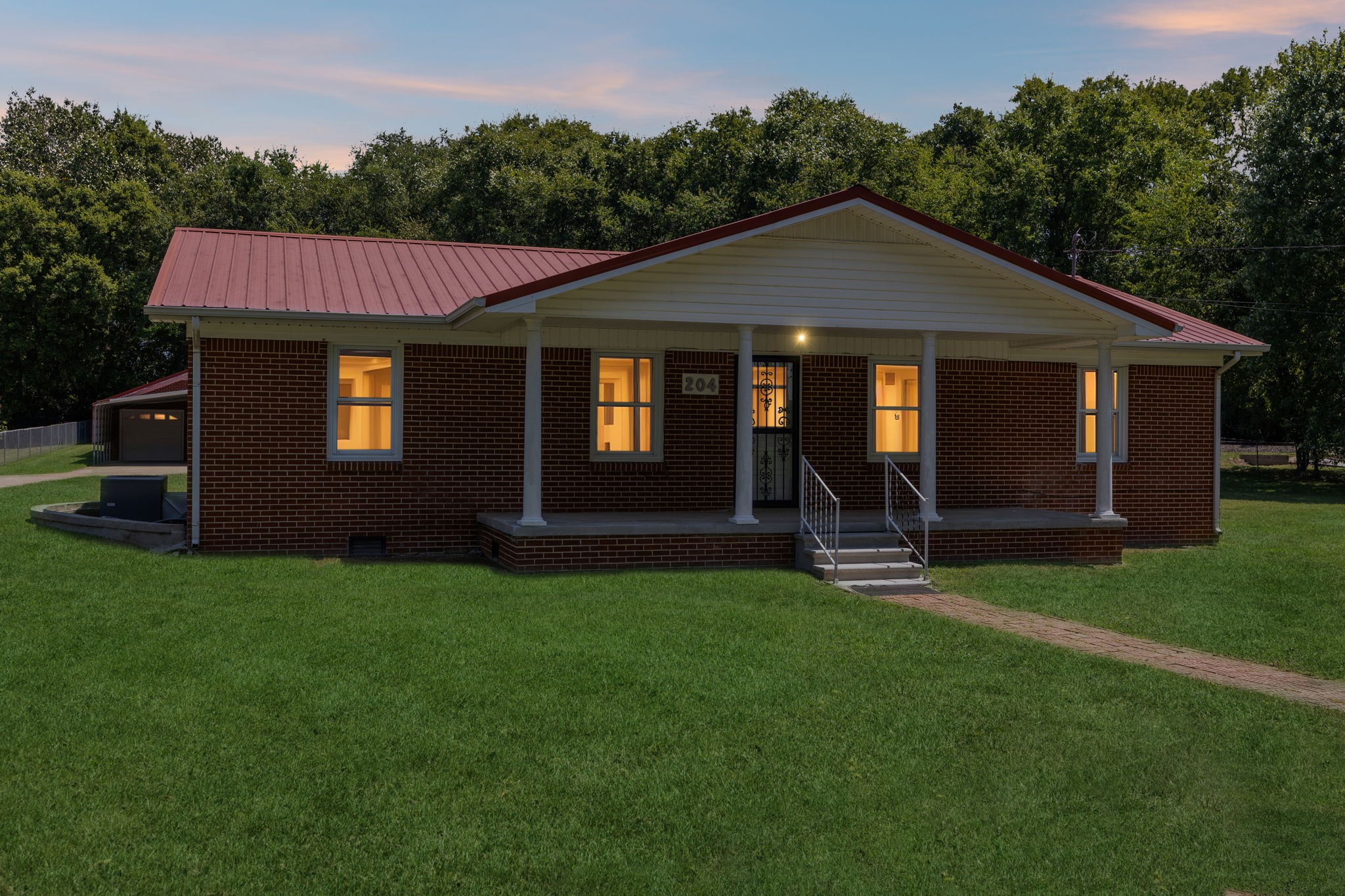 204 Canaan Road Mount Pleasant, TN 38474 - Photo 49 of 49 a front view of a house with a garden