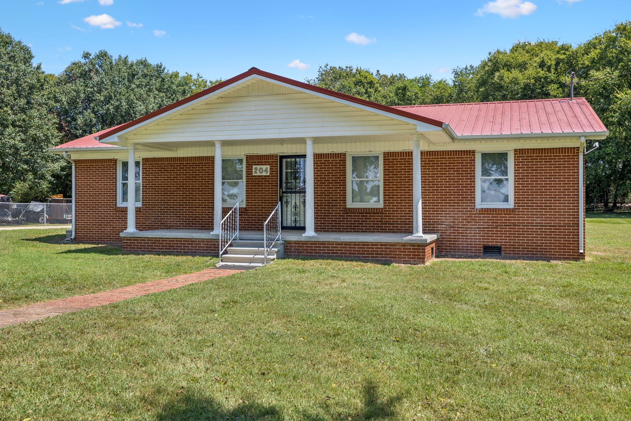 204 Canaan Road Mount Pleasant, TN 38474 - Photo 9 of 49 a view of a house with backyard and porch