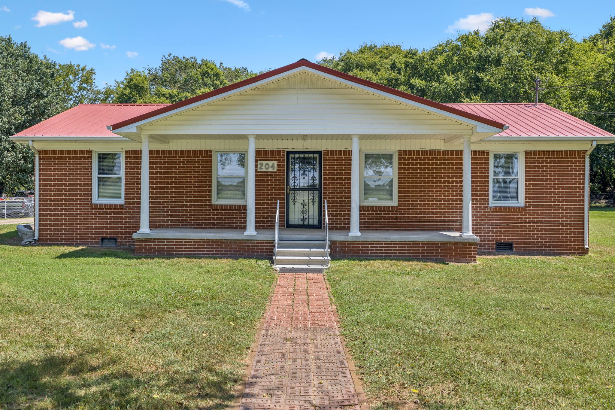 204 Canaan Road Mount Pleasant, TN 38474 - Photo 10 of 49 a front view of a house with yard