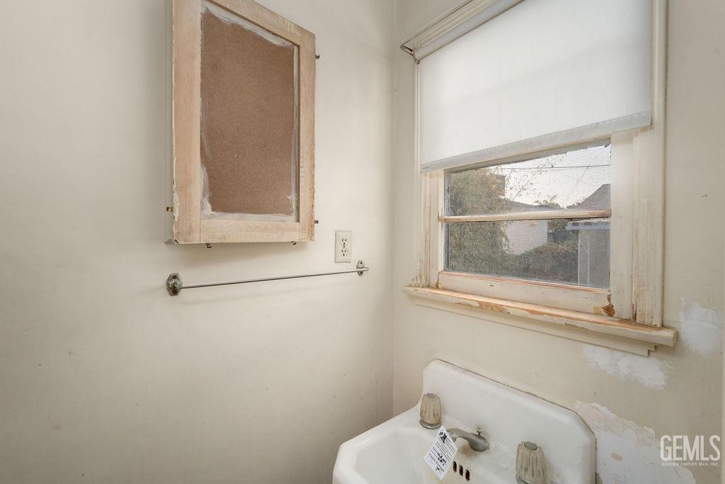 Undisclosed Address Bakersfield, CA 93305 - Photo 15 of 19 a bathroom with a window and a mirror