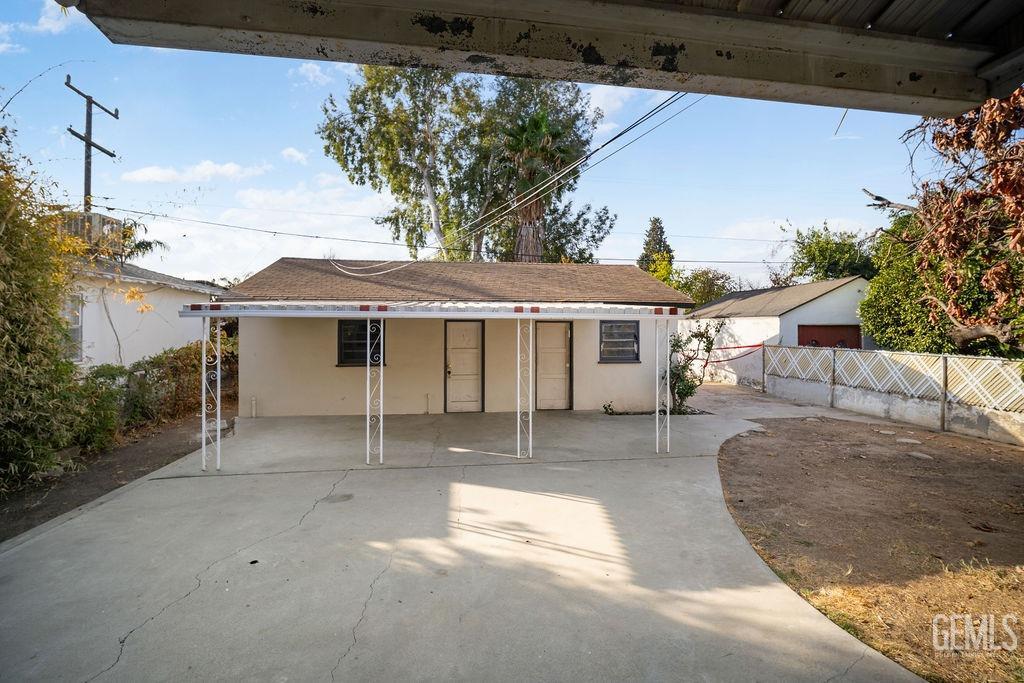 Undisclosed Address Bakersfield, CA 93305 - Photo 17 of 19 a view of a white house with a yard