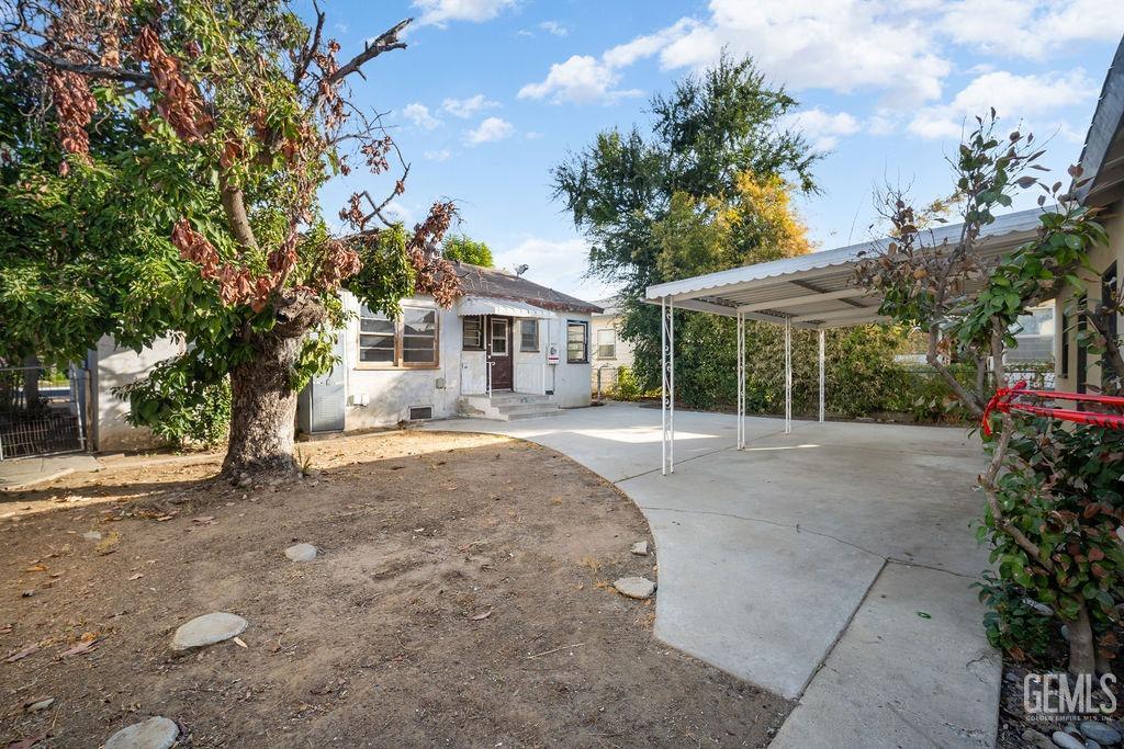 Undisclosed Address Bakersfield, CA 93305 - Photo 19 of 19 a view of a house with a backyard