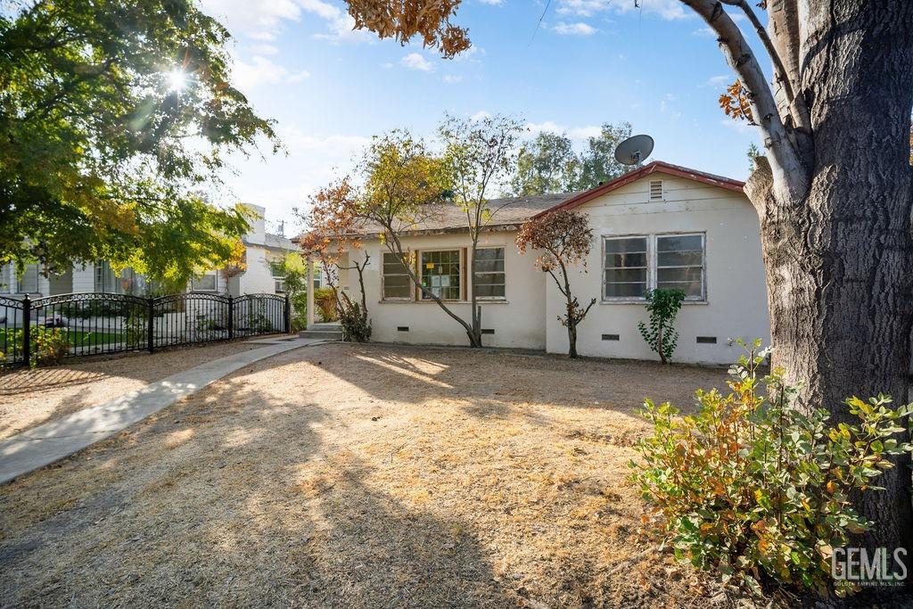 Undisclosed Address Bakersfield, CA 93305 - Photo 2 of 19 a view of a house with a yard