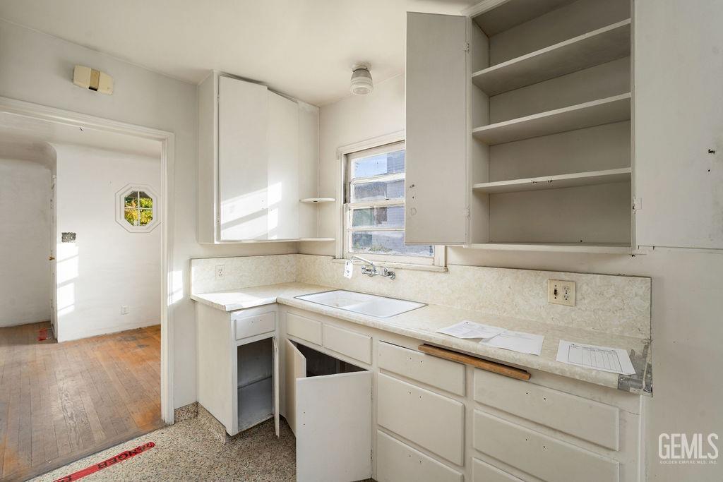 Undisclosed Address Bakersfield, CA 93305 - Photo 8 of 19 a bathroom with a sink and a mirror