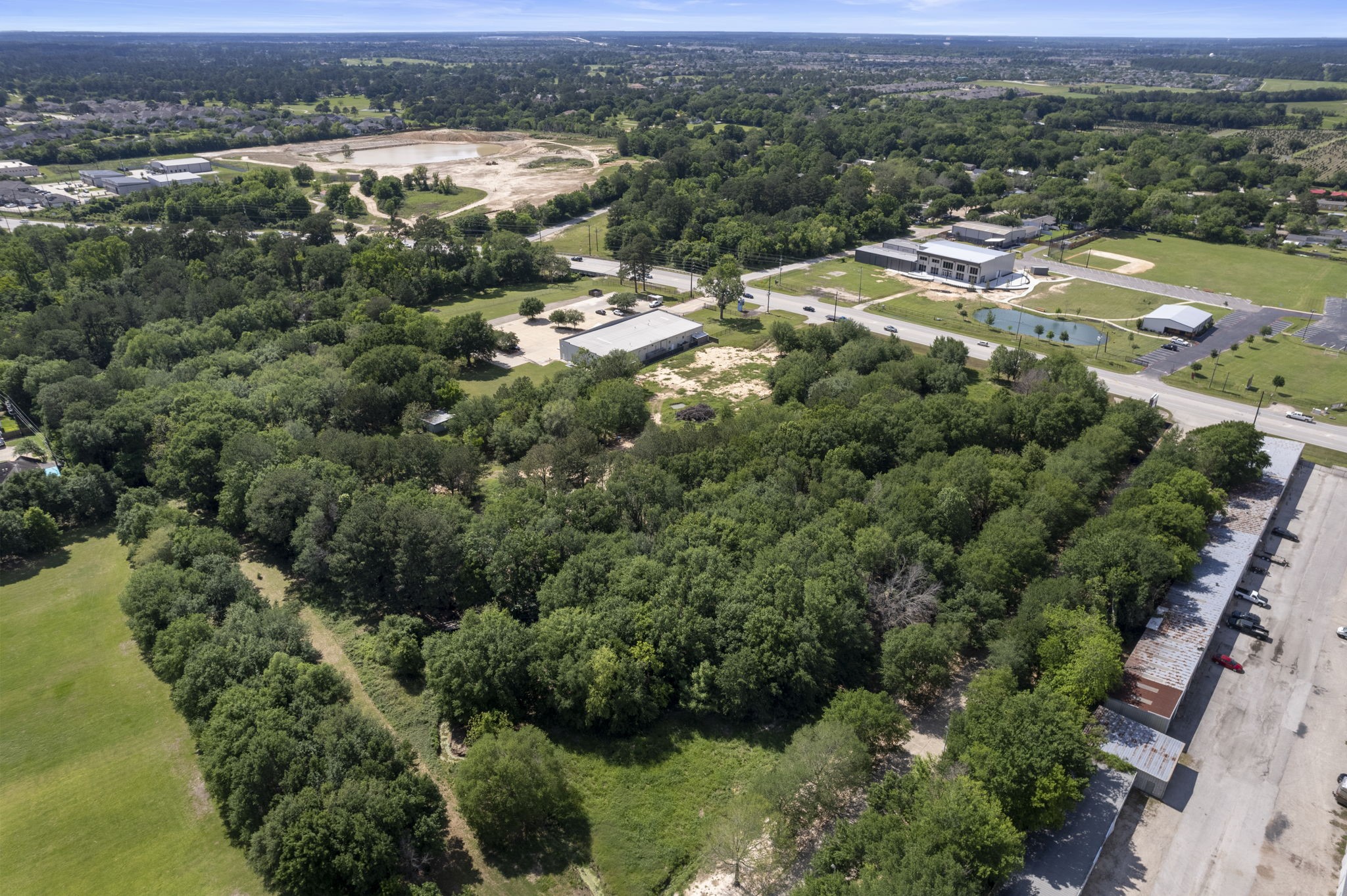 7803 Spring Cypress Road Spring, TX 77379 - Photo 12 of 14 an aerial view of residential houses with outdoor space and trees