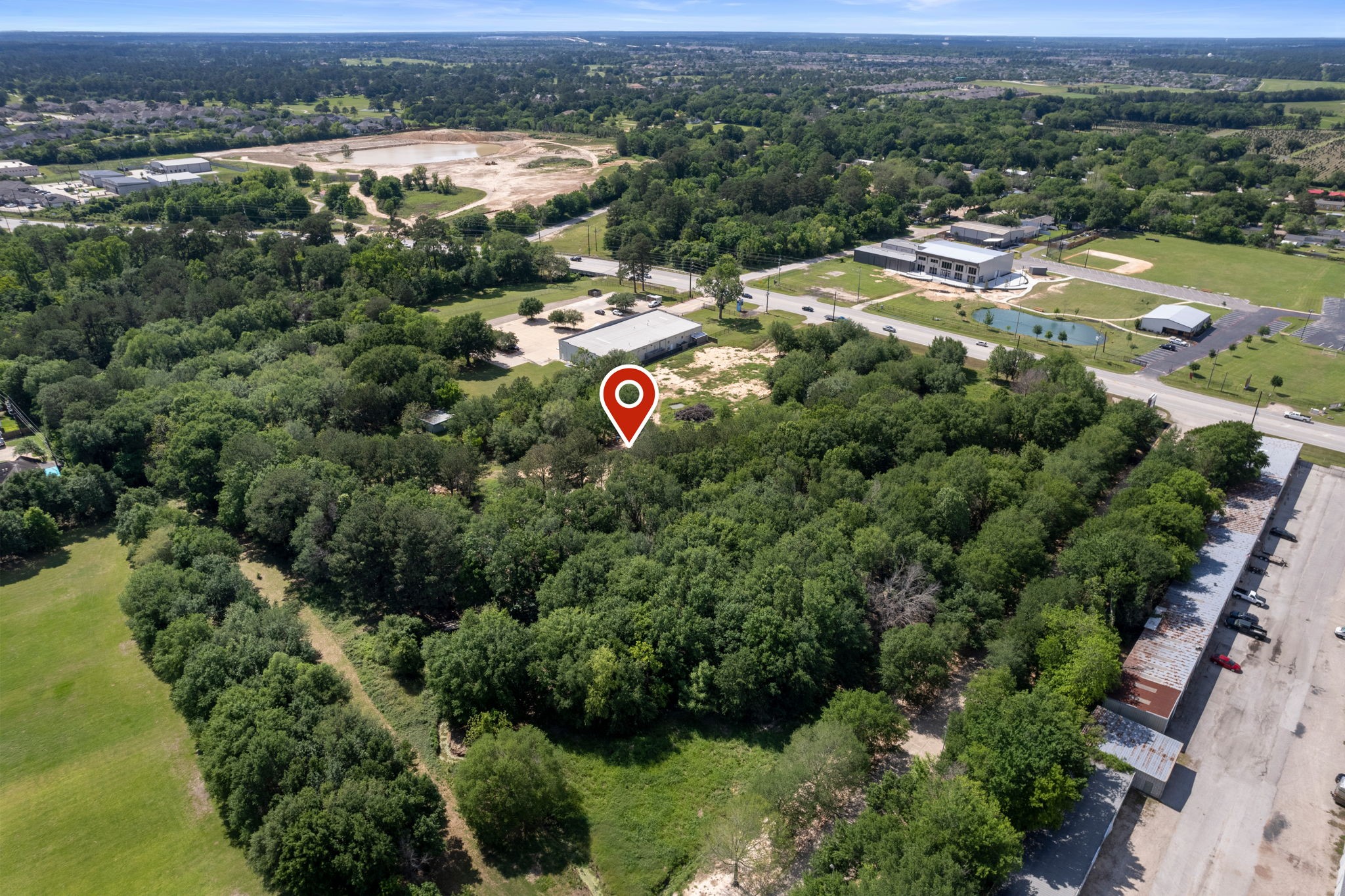 7803 Spring Cypress Road Spring, TX 77379 - Photo 4 of 14 an aerial view of a city with lots of residential buildings