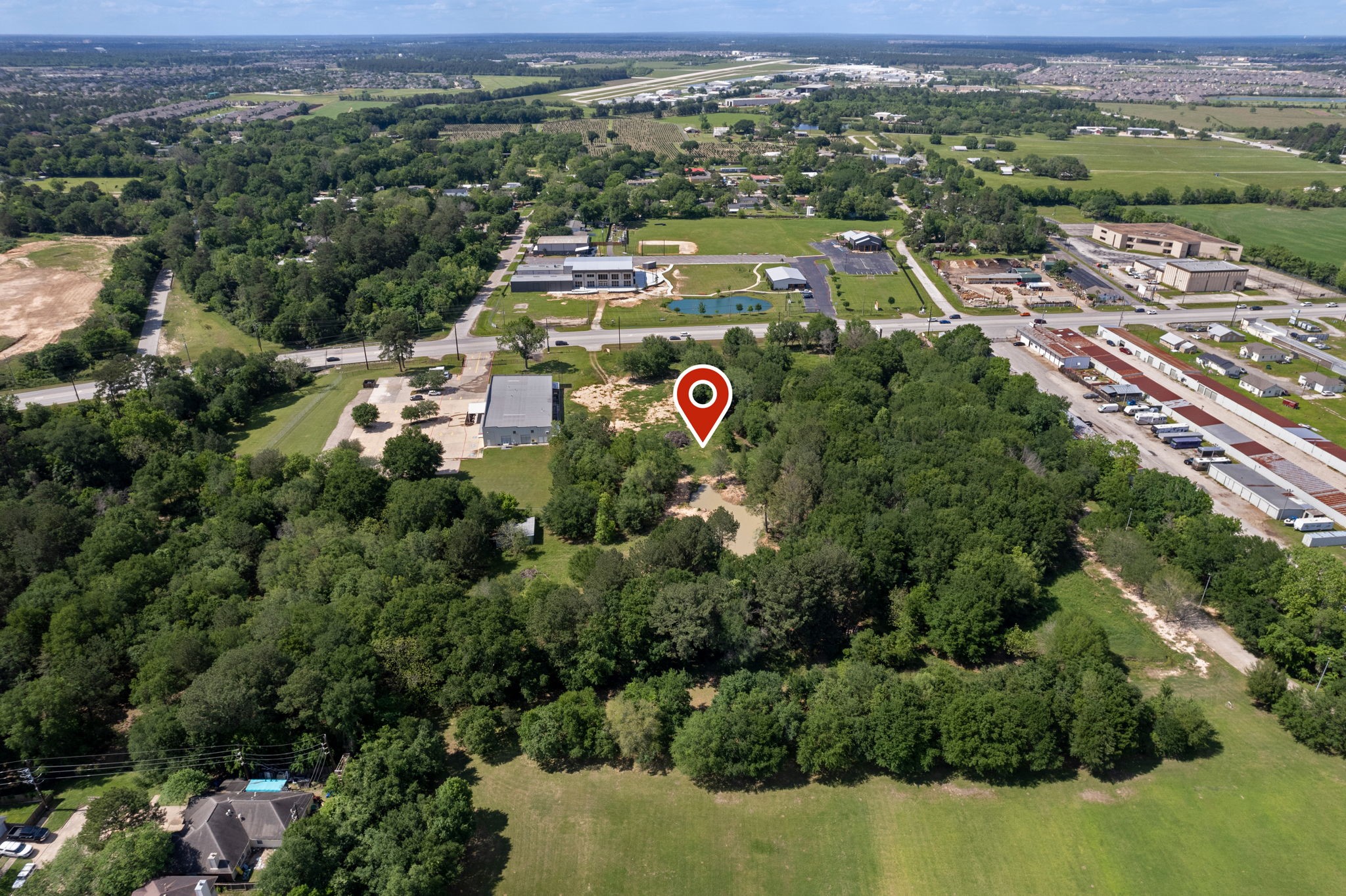 7803 Spring Cypress Road Spring, TX 77379 - Photo 5 of 14 an aerial view of residential houses with outdoor space and trees