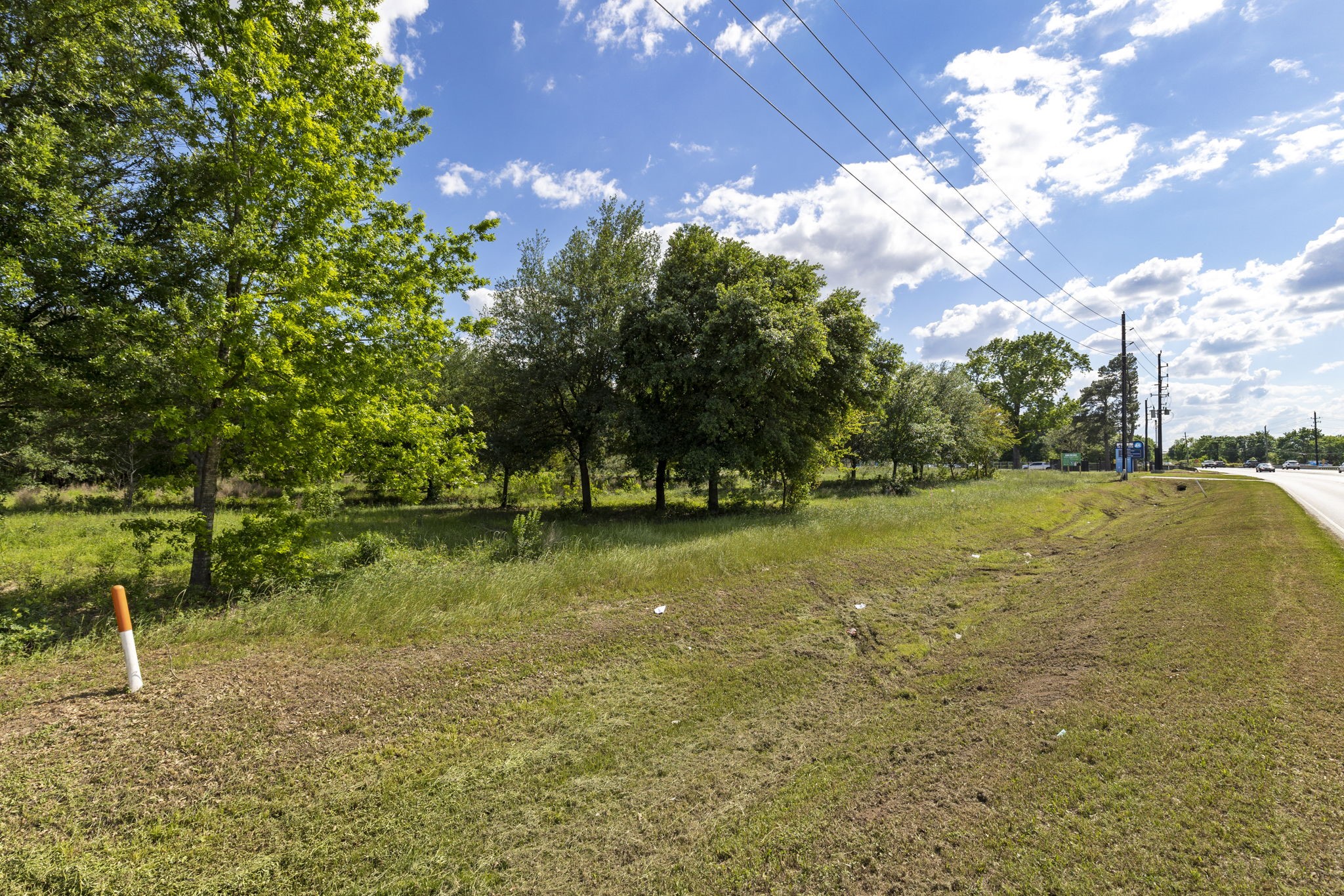 7803 Spring Cypress Road Spring, TX 77379 - Photo 7 of 14 a view of a golf course with a lake