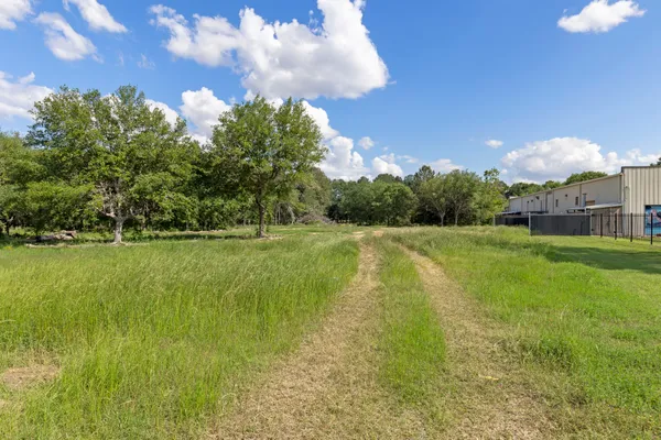 a view of a swimming pool with a yard