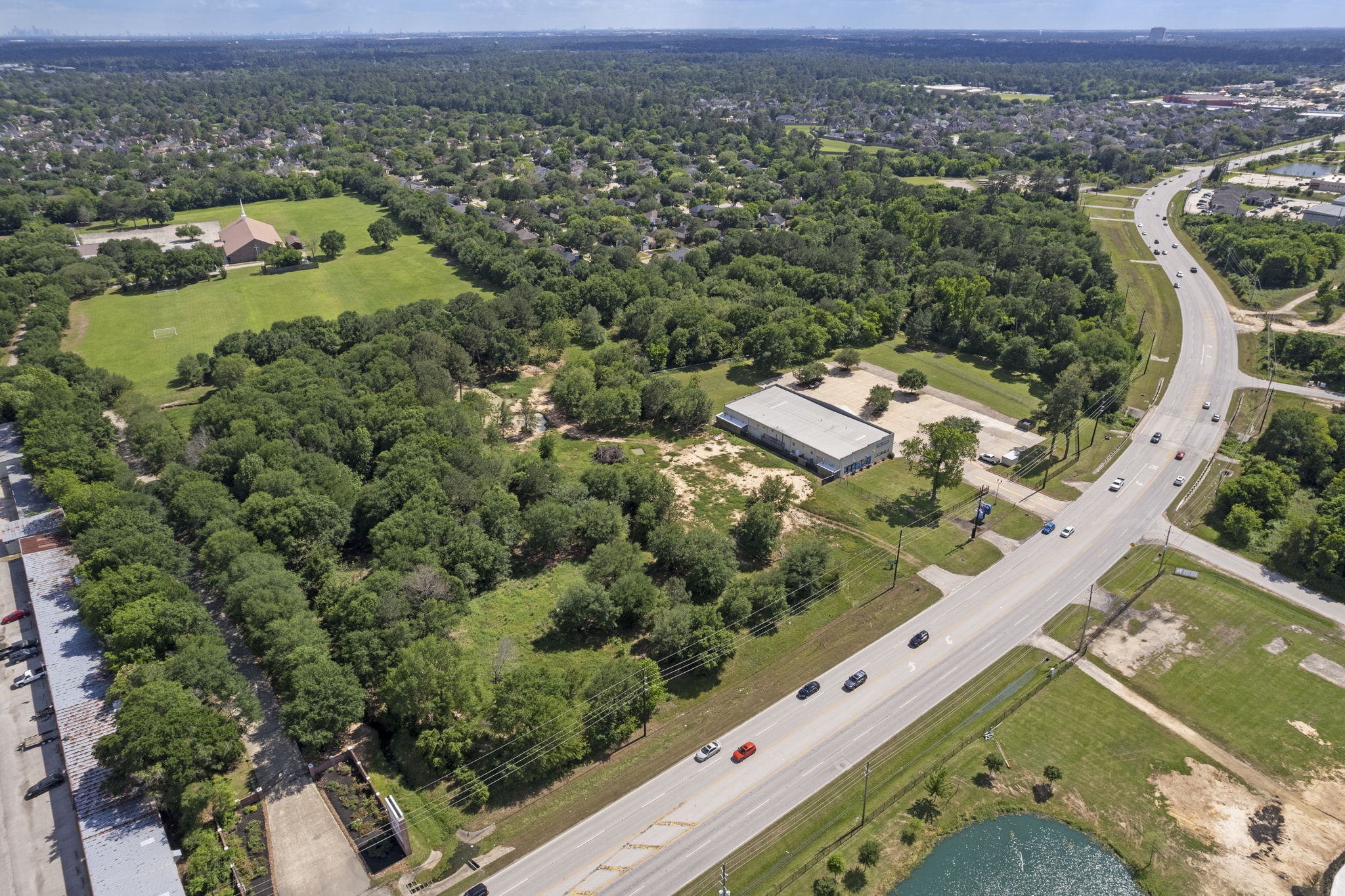 7803 Spring Cypress Road Spring, TX 77379 - Photo 10 of 14 an aerial view of residential houses with outdoor space
