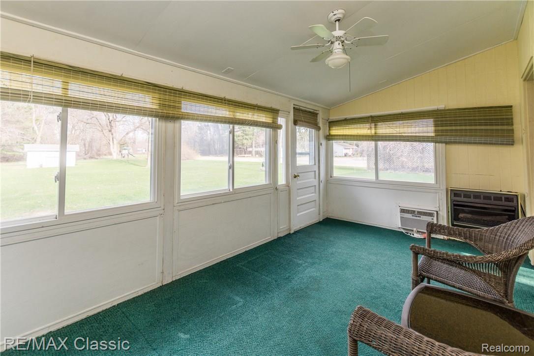 1369 Decker Road Walled Lake, MI 48390 - Photo 13 of 21 Enjoy many sunsets and family activities in the sun room. Heated and A/C