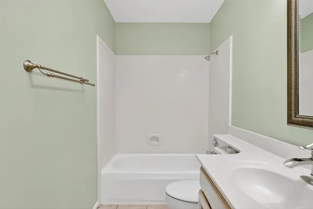 a bathroom with a sink a toilet and a bathtub