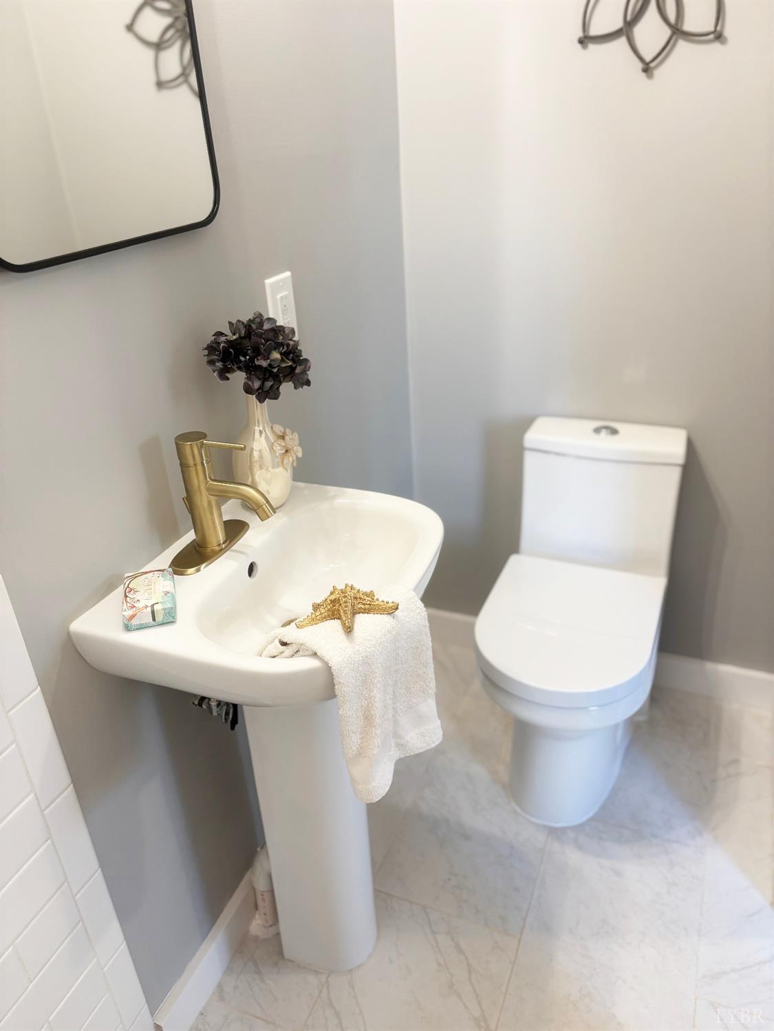 447 Matohe Road Monroe, VA 24574 - Photo 13 of 20 a bathroom with a sink mirror and toilet