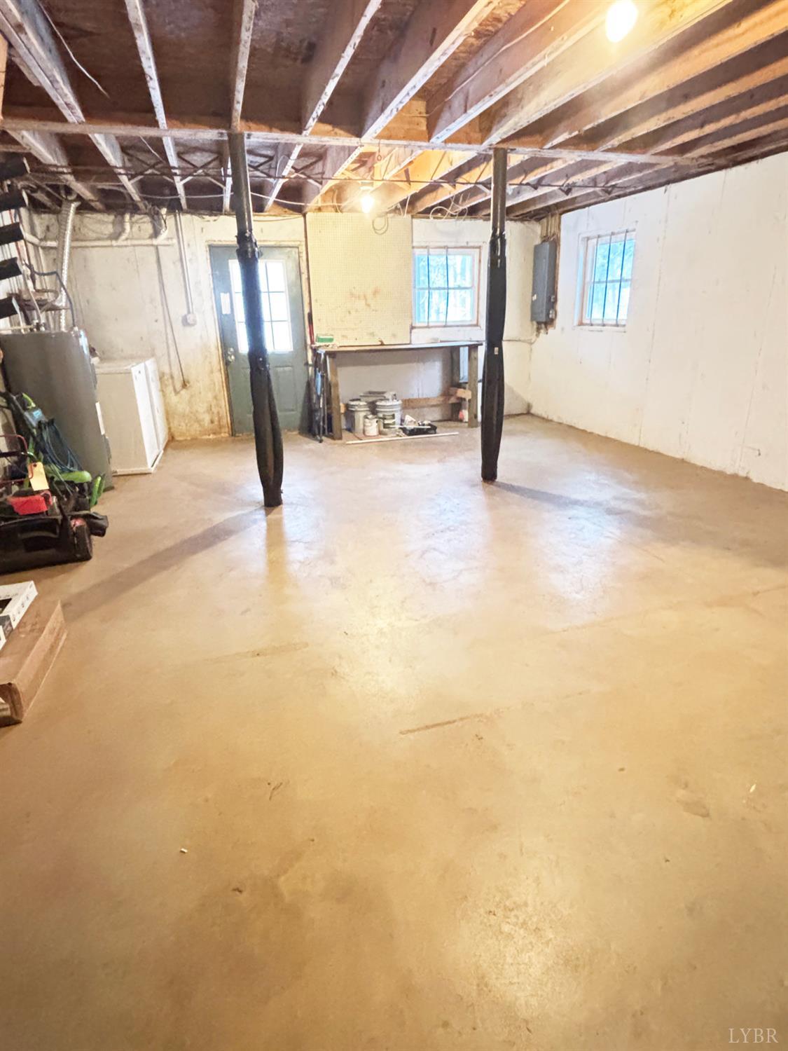 447 Matohe Road Monroe, VA 24574 - Photo 18 of 20 a view of water heater room with wooden floor