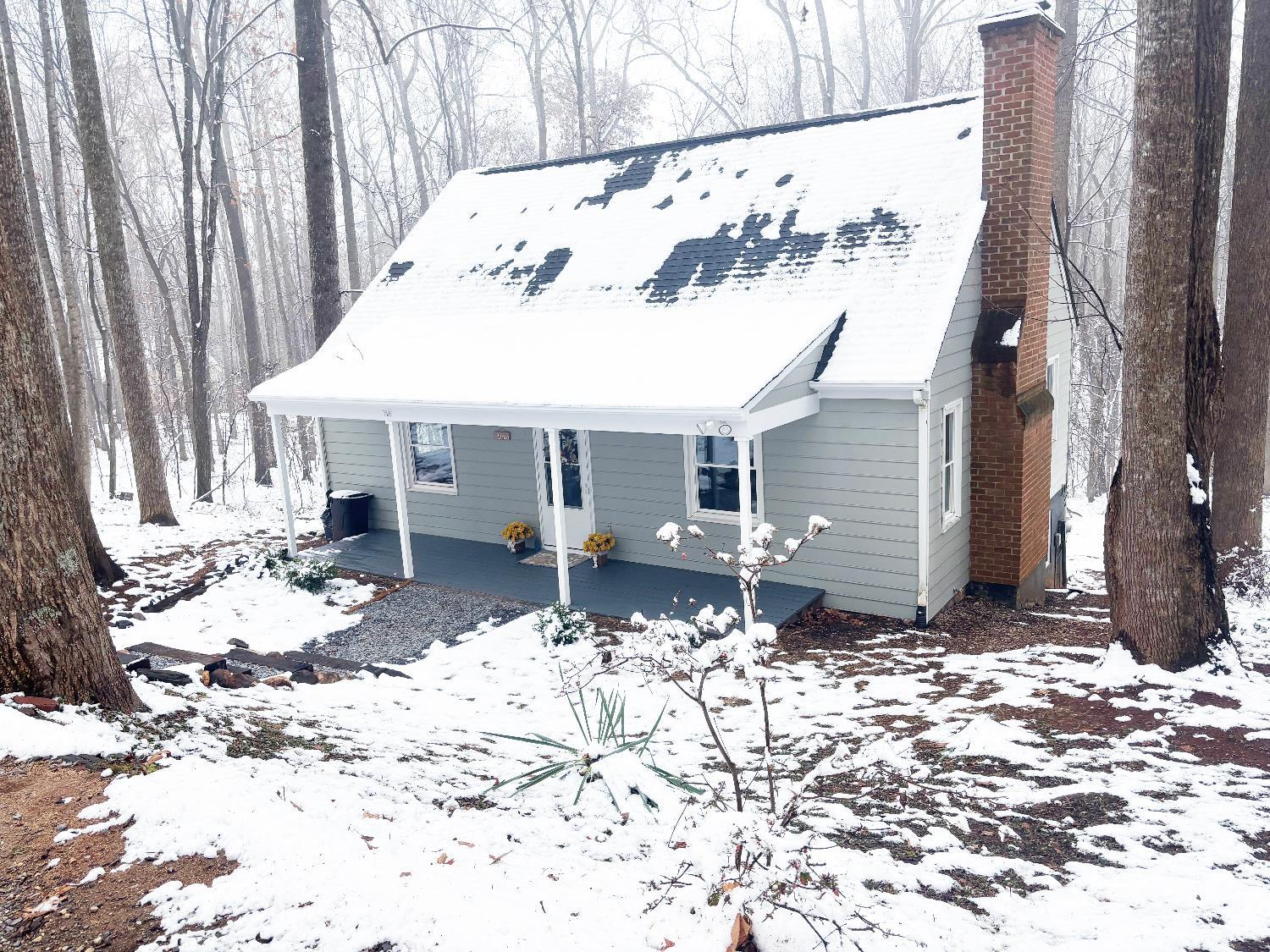 447 Matohe Road Monroe, VA 24574 - Photo 3 of 20 a view of a house with a yard covered in snow