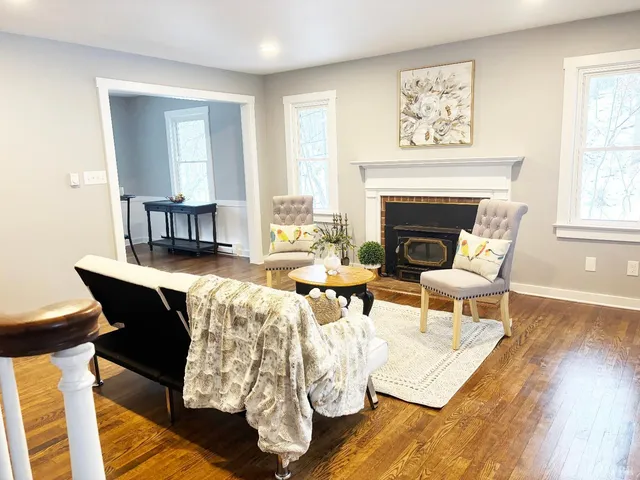 a living room with furniture and a fireplace
