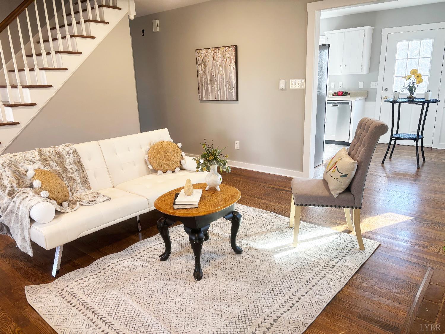 447 Matohe Road Monroe, VA 24574 - Photo 6 of 20 a living room with furniture and a dining table with wooden floor